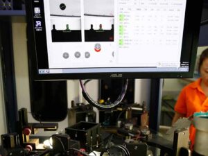 Close-up of screw quality testing at FHT factory, showcasing precision inspection and quality control for stainless steel fasteners to ensure high durability and performance.